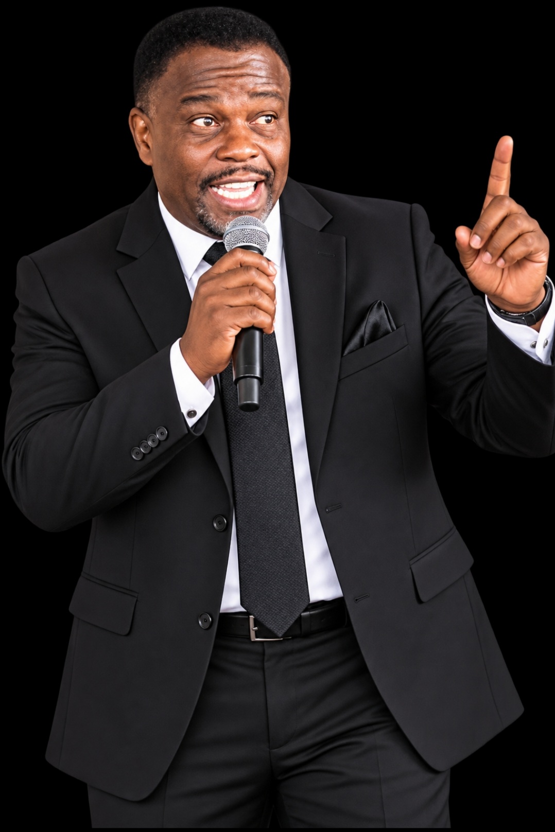 Pastor OJ Grace speaking into a microphone with a raised finger